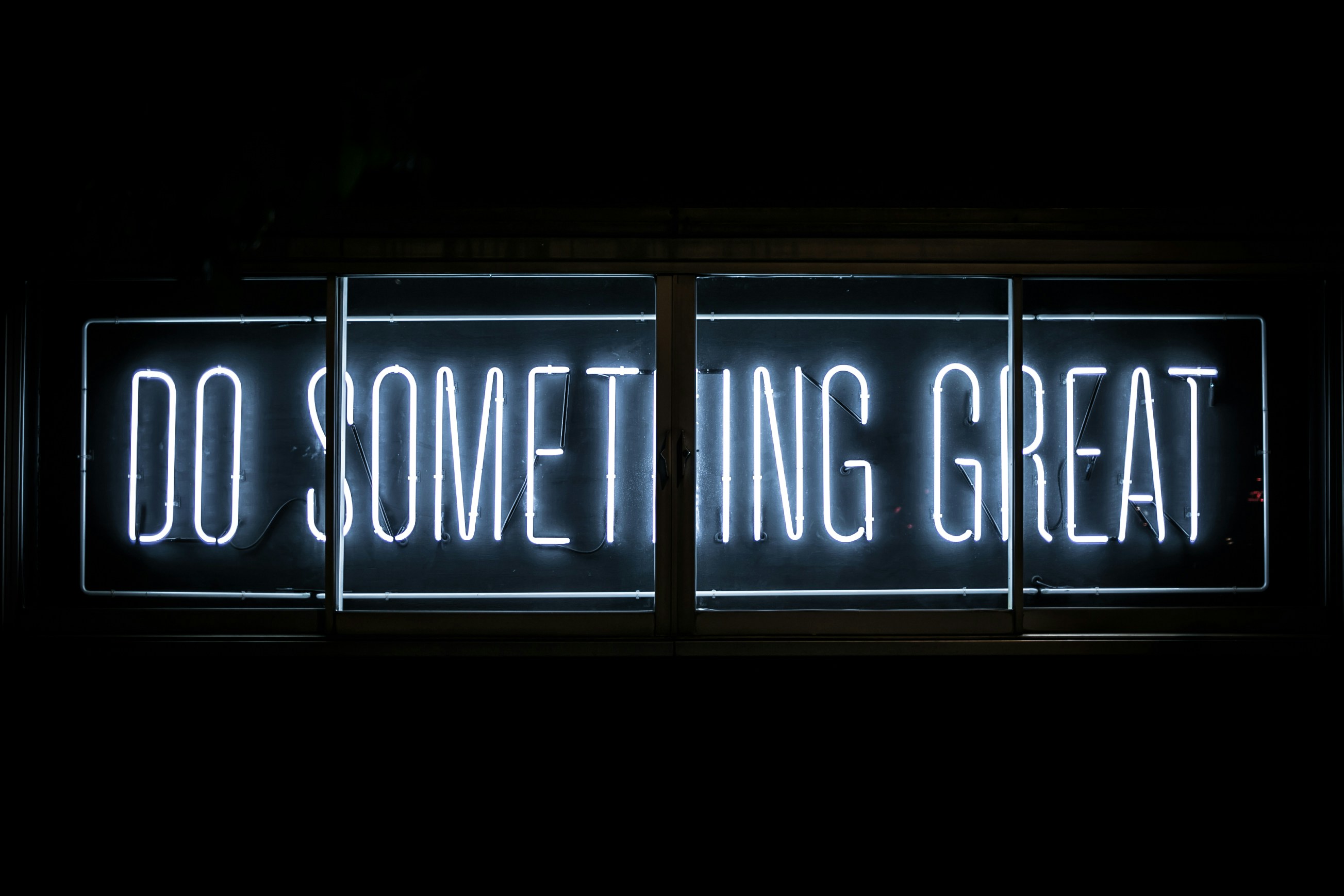 A sign that says 'DO SOMETHING GREAT'