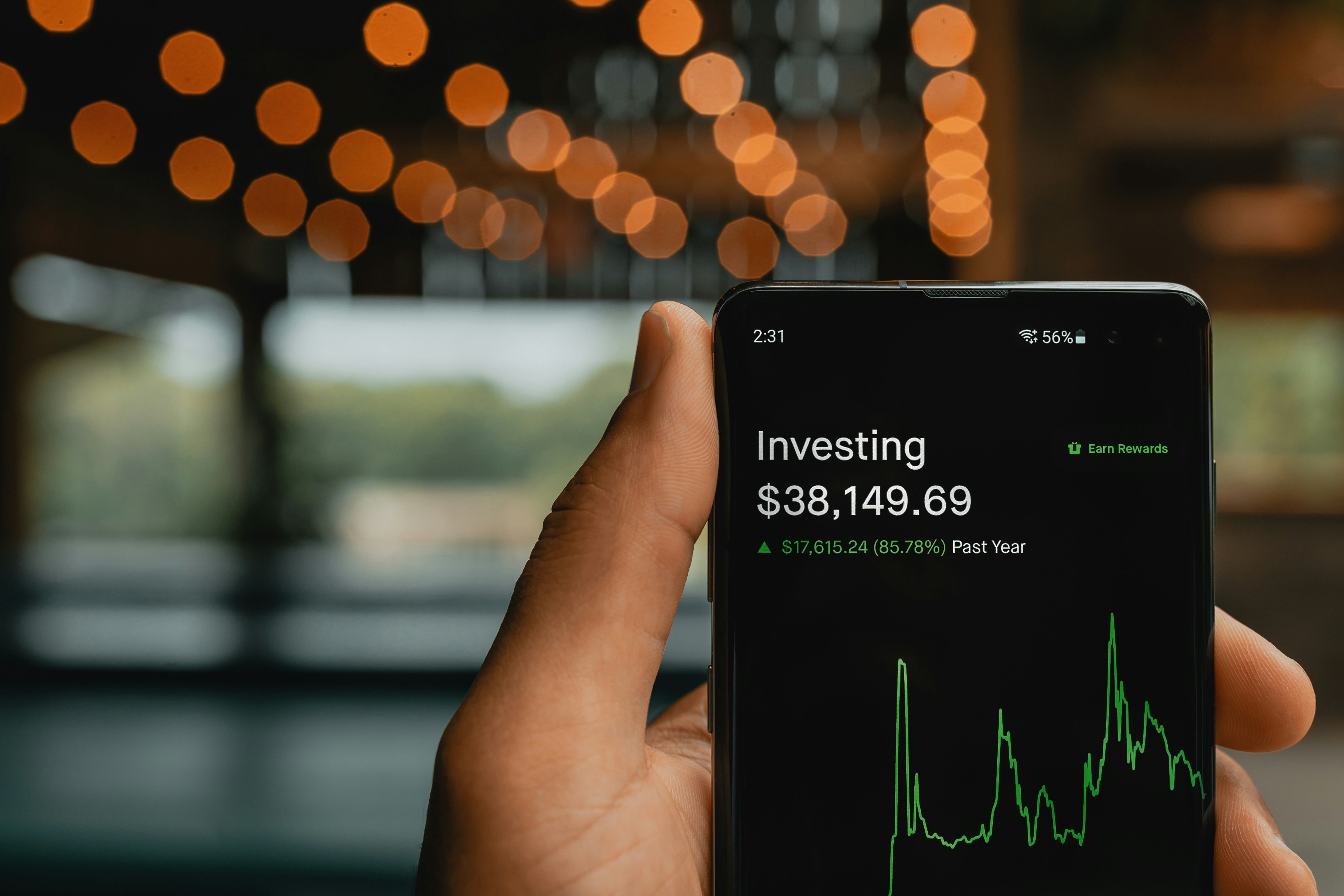 A phone showing a persons invested money in his portfolio